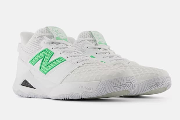 White and green New Balance tennis shoes.