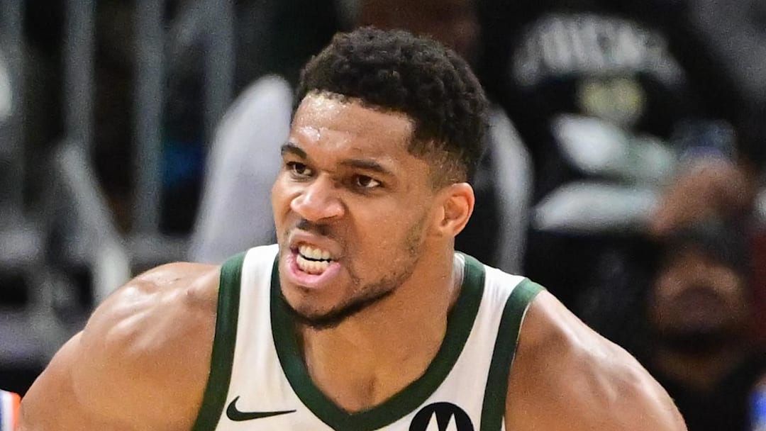 Milwaukee Bucks forward Giannis Antetokounmpo (34) reacts after scoring a basket in the 3rd quarter as New York Knicks guard Mikal Bridges (25) looks on at Fiserv Forum on October 28, 2025.