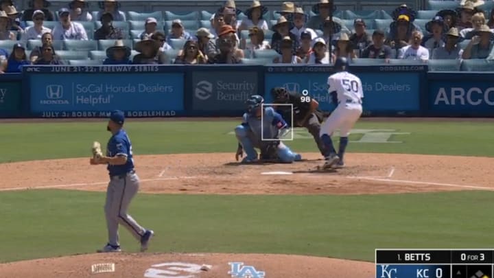 Los Angeles Dodgers shortstop Mookie Betts is hit by a pitch from Kansas City Royals relief pitcher Dan Altavilla. 