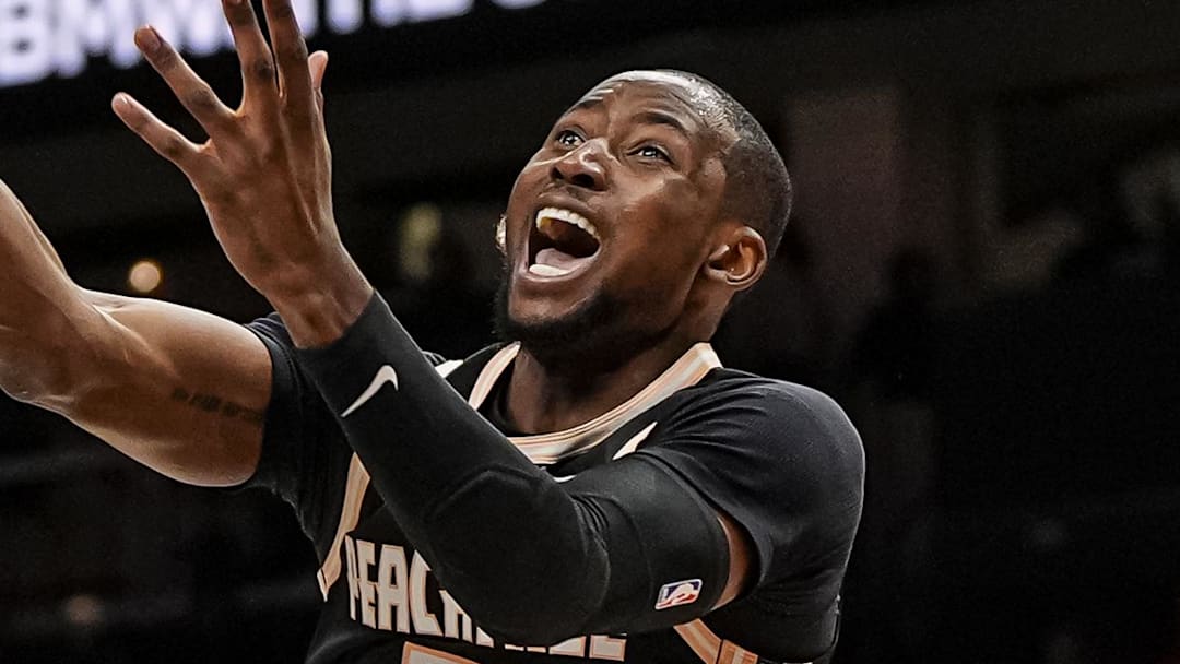 Mar 16, 2026; Atlanta, Georgia, USA; Atlanta Hawks forward Jonathan Kuminga (0) is called for an offensive foul on Orlando Magic guard Jalen Suggs (4) during the second half at State Farm Arena. Mandatory Credit: Dale Zanine-Imagn Images