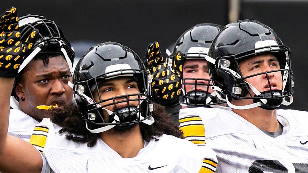 Iowa defensive linemen Anterio Thompson (54), Jackson Filer (33) and Caden Crawford (97) wave to patients in the Stead Family Children's Hospital wave during the Hawkeyes' final spring NCAA football practice, Saturday, April 22, 2023, at Kinnick Stadium in Iowa City, Iowa.

230422 Iowa Spring Fb 075 Jpg