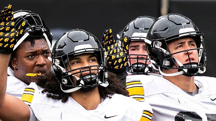 Iowa defensive linemen Anterio Thompson (54), Jackson Filer (33) and Caden Crawford (97) wave to patients in the Stead Family Children's Hospital wave during the Hawkeyes' final spring NCAA football practice, Saturday, April 22, 2023, at Kinnick Stadium in Iowa City, Iowa.

230422 Iowa Spring Fb 075 Jpg