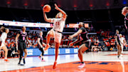Illinois senior guard Adalia McKenzie (24) drives for a layup against Penn State in the Illini's 67-55 win Thursday at the State Farm Center in Champaign, Illinois.