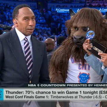 Stephen A. Smith reacts to Malika Andrews being given a button.