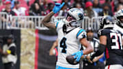 Nov 16, 2025; Atlanta, Georgia, USA; Carolina Panthers wide receiver Tetairoa McMillan (4) celebrates a touchdown in the first quarter against the Atlanta Falcons at Mercedes-Benz Stadium.