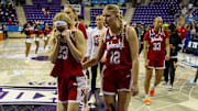 Nebraska women's basketball players walk off the court in Fort Worth after an NCAA Tournament first round loss to Louisville.
