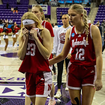 Nebraska women's basketball players walk off the court in Fort Worth after an NCAA Tournament first round loss to Louisville.