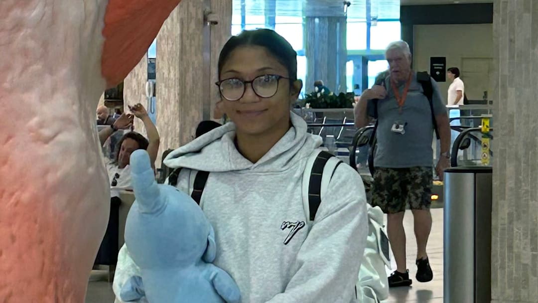 Mckendree wrestler Gabby Tedesco stands by a bird statue at Tampa International Airport Tuesday while waiting for her flight to Peru for the Pan-American Championships.