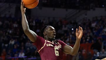 Florida State guard Robert McCray V (6) shoots past Florida forward Thomas Haugh (10) during the first half of an NCAA mens basketball game at Exactec Areana at the Steven C. O Connell Center in Gainesville, FL on Tuesday, November 11, 2025. [Alan Youngblood/Gainesville Sun]