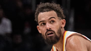 Trae Young #11 of the Atlanta Hawks dribbles.