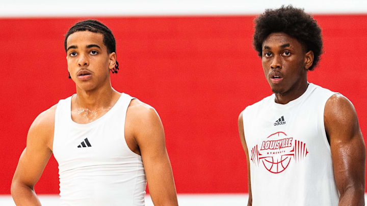 Louisville men's basketball guards Mikel Brown Jr. and Adrian Wooley Louisville men's basketball guards Mikel Brown Jr. and Adrian Wooley
