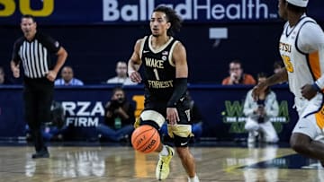 Nate Calmese dribbles the ball up the court in exhibition vs ETSU