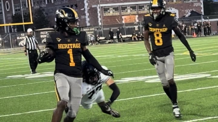 American Heritage receiver Malachi Toney (1) gets to the sidelines after a long completion in a win against Western. Toney had two touchdowns on the night.