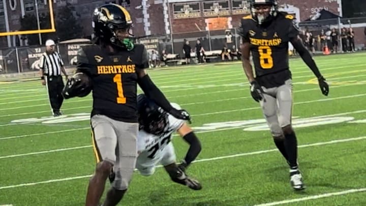 American Heritage receiver Malachi Toney (1) gets to the sidelines after a long completion in a win against Western. Toney had two touchdowns on the night.