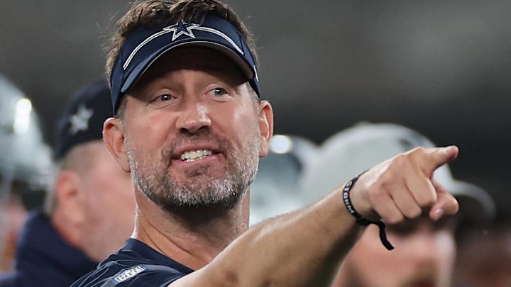 Dallas Cowboys head coach Brian Schottenheimer coaches during warm-ups before the game against the New York Giants at MetLife Stadium.