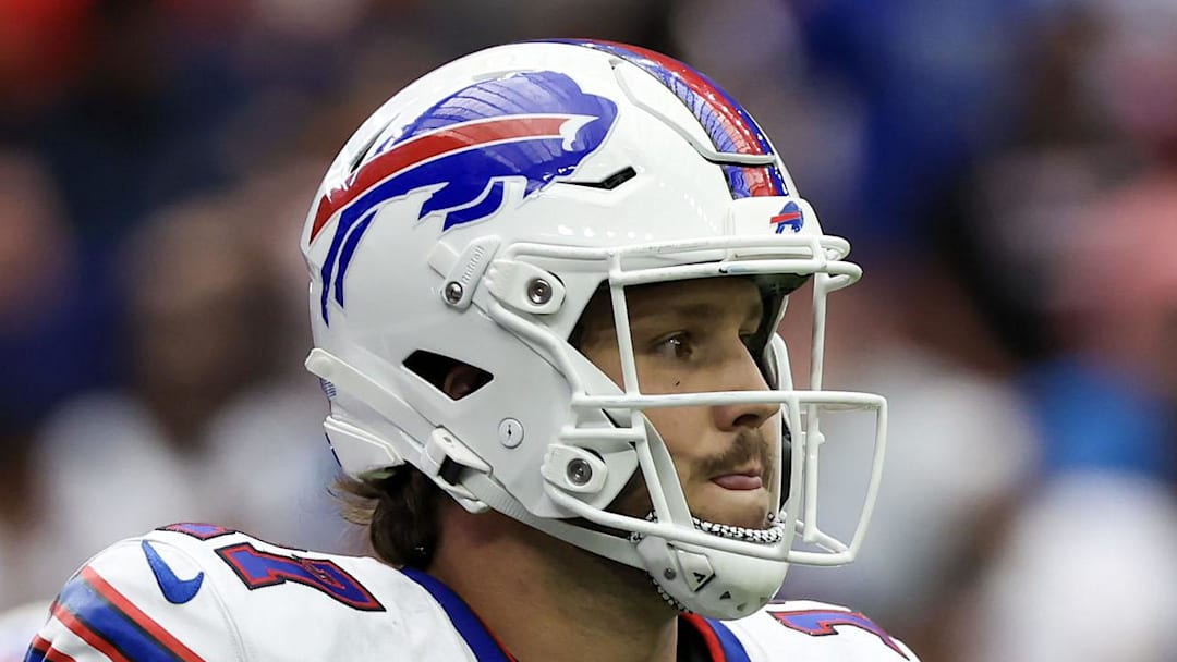 Buffalo Bills quarterback Josh Allen runs off the field before the Bills punt to the Houston Texans. Buffalo Bills quarterback Josh Allen runs off the field before the Bills punt to the Houston Texans.