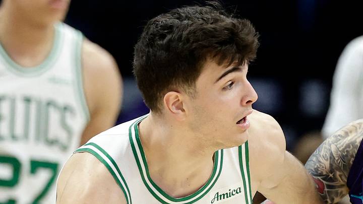 Mar 29, 2026; Charlotte, North Carolina, USA; Boston Celtics guard Hugo González (28) keeps the ball away from Charlotte Hornets guard LaMelo Ball (1) during the second half at Spectrum Center. Mandatory Credit: Brian Westerholt-Imagn Images