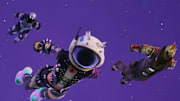 Fortnite characters blasting off and diving back to the ground.