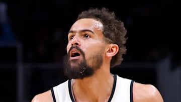 Trae Young #11 of the Atlanta Hawks looks to make a play against the Philadelphia 76ers.