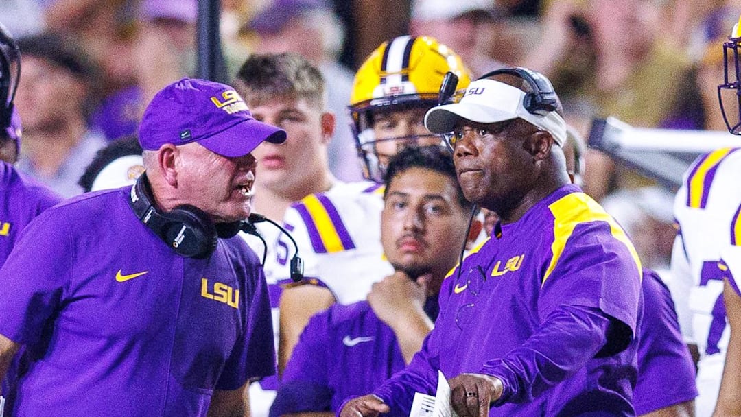 Sep 6, 2025; Baton Rouge, Louisiana, USA;  LSU Tigers head coach Brian Kelly reacts against associate head coach Frank Wilson during the second half against Louisiana Tech Bulldogs at Tiger Stadium. Mandatory Credit: Stephen Lew-Imagn Images