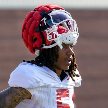 Arkansas Razorbacks wide receiver Tyrone Broden takes a break during practice Monday morning on the outdoor practice fields in Fayetteville, Ark.