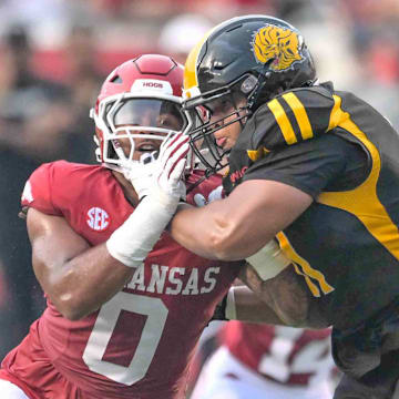 Arkansas Razorbacks defensive lineman Nico Davillier rushing the passer against UAPB in the season opener in Little Rock, Ark.