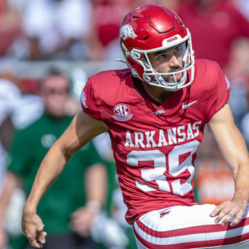 Arkansas Razorbacks kicker Kyle Ramsey kicks against the UAB Blazers at Razorback Stadium in Fayetteville, Ark.