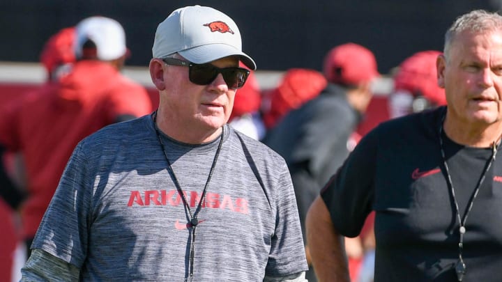 Arkansas Razorbacks offensive coordinator Bobby Petrino with coach Sam Pittman watching first day of fall practices on outdoor fields in Fayetteville, Ark.