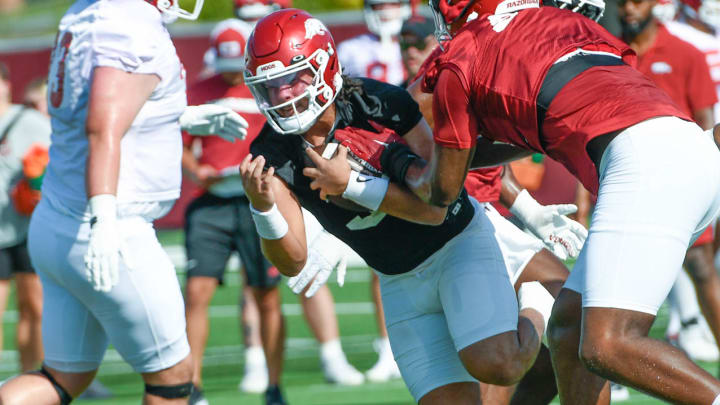 Arkansas Razorbacks quarterback Malachi Singleton runs during 7-on-7 part of Wednesday's first practice on the outdoor fields in Fayetteville, Ark.