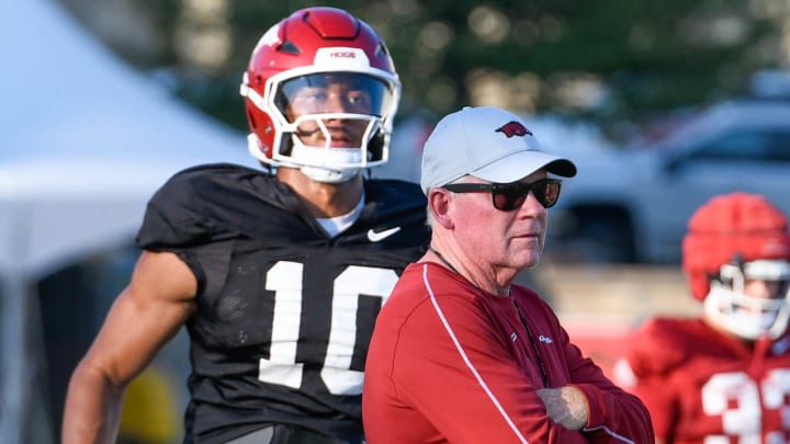 Arkansas Razorbacks offensive coordinator Bobby Petrino working with quarterback Taylen Green at Saturday's practice on the outdoor fields in Fayetteville, Ark.