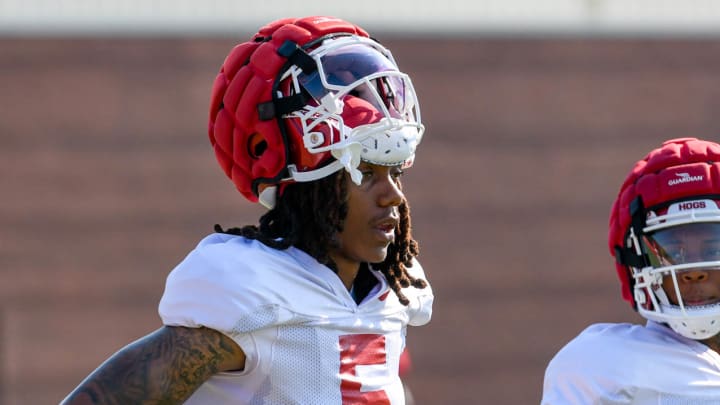 Arkansas Razorbacks wide receiver Tyrone Broden takes a break during practice Monday morning on the outdoor practice fields in Fayetteville, Ark.