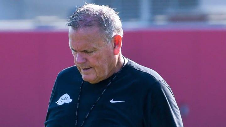 Arkansas Razorbacks coach Sam Pittman walks to a different position group during a fall camp practice on the outdoor practice field in Fayetteville, Ark.