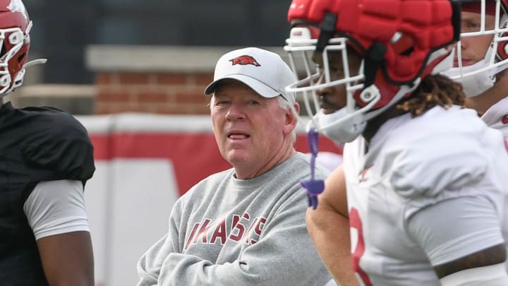 Arkansas Razorbacks offensive coordinator on the field at practice Tuesday morning on the outdoor field in Fayetteville, Ark.