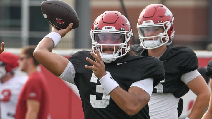 Arkansas Razorbacks backup quarterback Malachi Singleton throws a pass during Tuesday morning's practice on the outdoor field in Fayetteville, Ark.