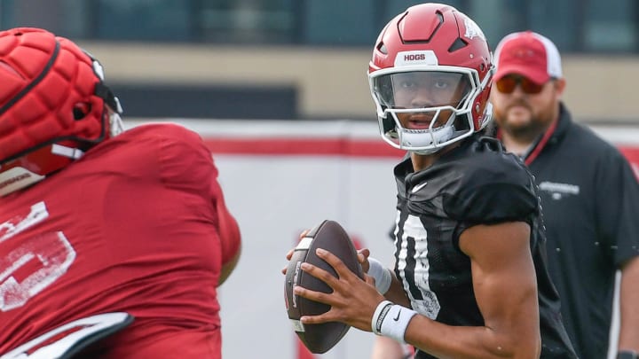 Arkansas Razorbacks quarterback Taylen Green drops back during fall camp practices Aug. 13, 2024, in Fayetteville, Ark.