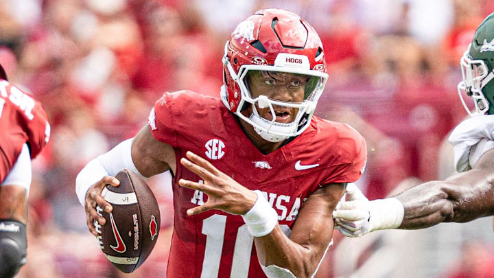 Arkansas Razorbacks quarterback Taylen Green runs through an opening in the UAB Blazers' defense Saturday afternoon at Razorback Stadium in Fayetteville, Ark.