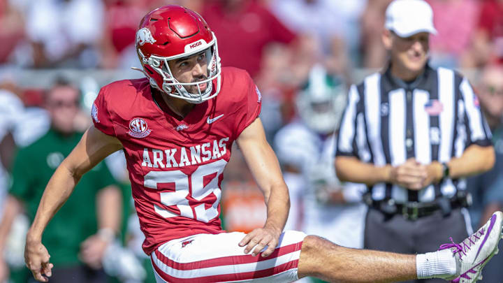 Arkansas Razorbacks kicker Kyle Ramsey kicks against the UAB Blazers at Razorback Stadium in Fayetteville, Ark.