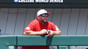 Jun 25, 2021; Omaha, Nebraska, USA; A staff member for the NC State Wolfpack waits out a COVID protocol delay before the game against the Vanderbilt Commodores at TD Ameritrade Park. Mandatory Credit: Steven Branscombe-Imagn Images