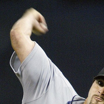 Seattle Mariners pitcher #38 Joel Pineiro pitches to the Minnesota Twins in the third inning at the Metrodome in 2005.