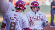 Arkansas Razorbacks designated hitter Kuhio Aloy crosses home after a homer against UCA at Baum-Walker Stadium in Fayetteville, Ark.