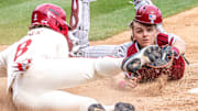 Arkansas Razorbacks Cam Kozeal is tagged out trying to score by South Carolina Gamecocks catcher Gavin Braland in their game at Baum-Walker Stadium in Fayetteville, Ark.
