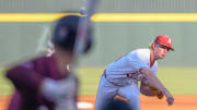 Arkansas Razorbacks pitcher Tate McGuire throws a pitch in the first inning against the Little Rock Trojans at Baum-Walker Stadium in Fayetteville, Ark.