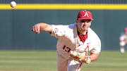 Arkansas Razorbacks relief pitcher Steele Eaves throws a pitch from the mound against the Little Rock Trojans at Baum-Walker Stadium in Fayetteville, Ark