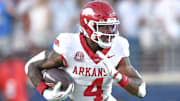 Arkansas Razorbacks running back Mike Washington breaking free against the Ole Miss Rebels in a game at Vaught-Hemingway Stadium in Oxford, Miss.