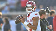 Arkansas Razorbacks quarterback Taylen Green dropping back to pass against the Ole Miss Rebels at Vaught-Hemingway Stadium in Oxford, Miss.