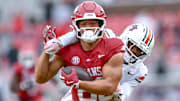 Arkansas Razorbacks tight end Rohan Jones tries to break away from Auburn Tigers defender in game at Razorback Stadium in Fayetteville, Ark.