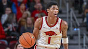 Arkansas Razorbacks guard Meleek Thomas bringing the ball upcourt against the Fresno State Bulldogs at Simmons Bank Arena in North Little Rock, Ark.