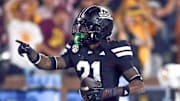 Mississippi State Bulldogs defensive back Hunter Washington (21) reacts after a interception during the fourth quarter against the Arizona State Sun Devils at Davis Wade Stadium at Scott Field.