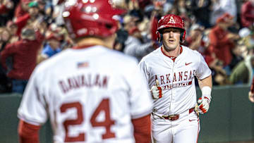 Arkansas Razorbacks Logan Maxwell comes to the plate after hitting a home run against the South Carolina Gamecocks at Baum-Walker Stadium in Fayetteville, Ark.