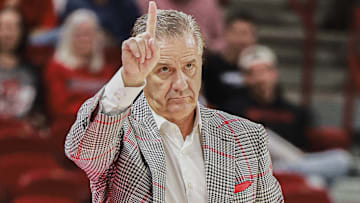 Arkansas Razorbacks coach John Calipari motions to players on the floor in game against Jackson State at Bud Walton Arena in Fayetteville, Ark.